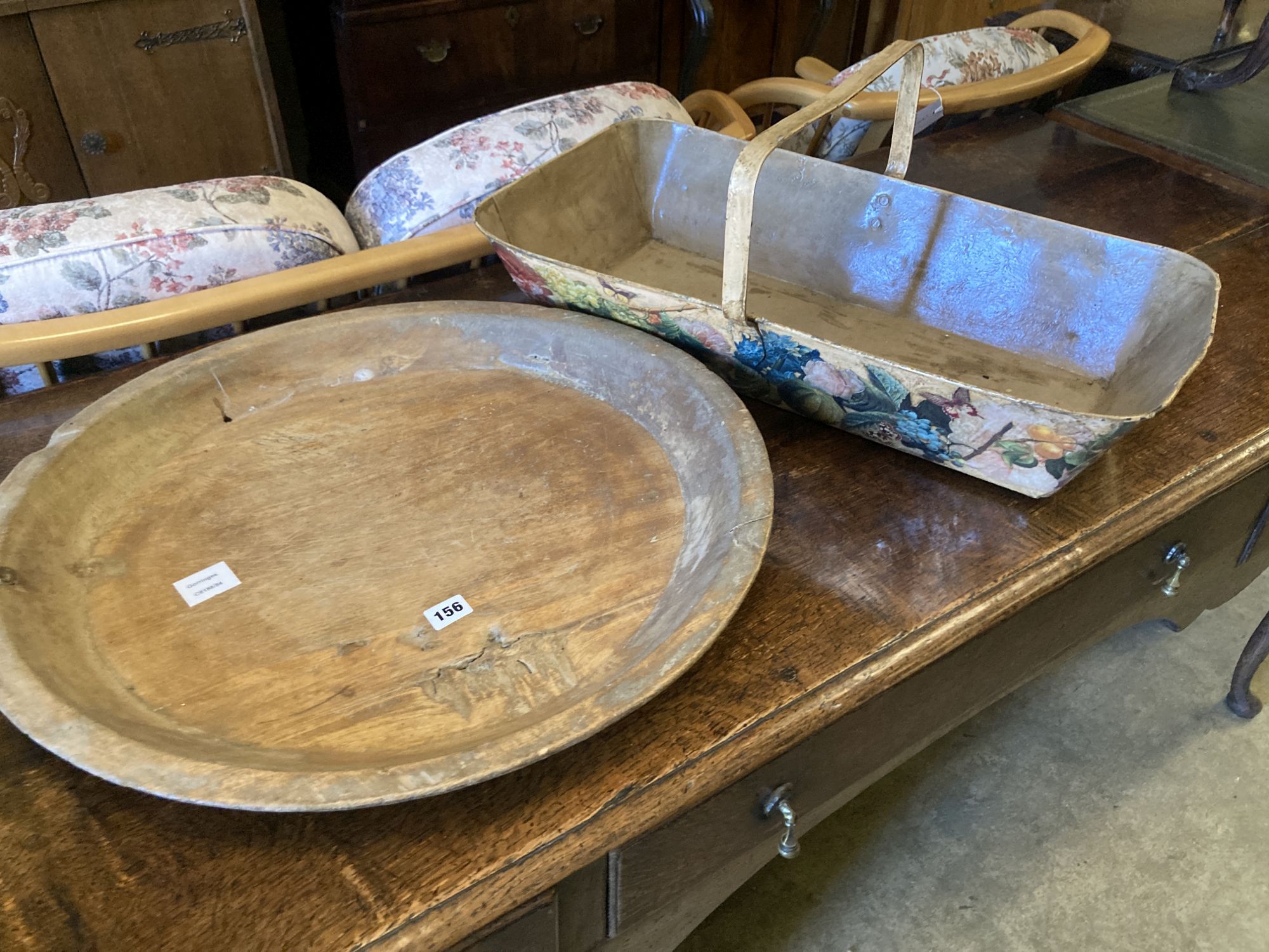 A circular treen shallow bowl and a painted toleware trug, width 69cm, depth 36cm, height 32cm